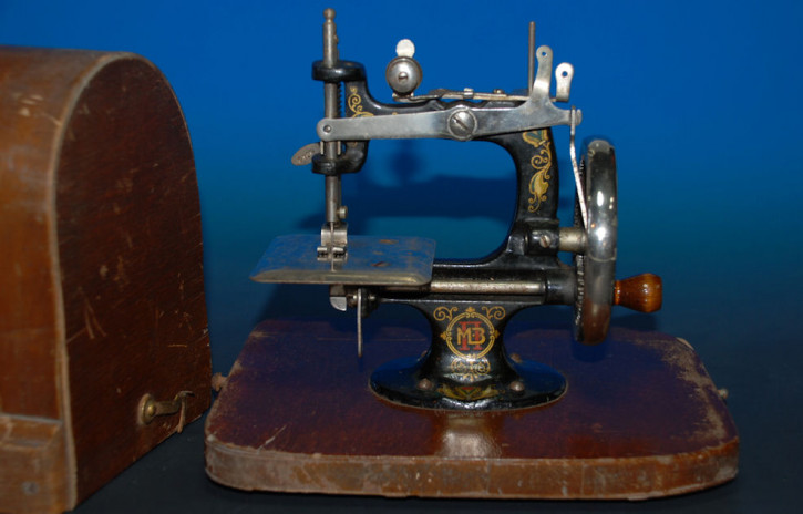 antique children sewing machine with wood hood * at 1900-1920