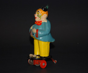 antique wheeled paper mache clown with flywheel drive * Thuringia 30s