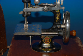 antique children sewing machine with wood hood * at 1900-1920