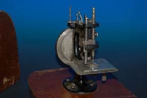 antique children sewing machine with wood hood * at 1900-1920